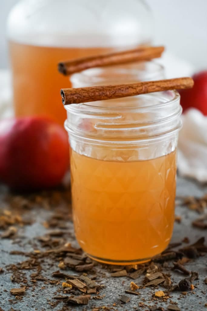 apple cider served in a mason jar