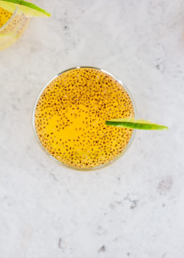 Overhead shot of pineapple agua fresca served with a slice of lime on the side of the glass