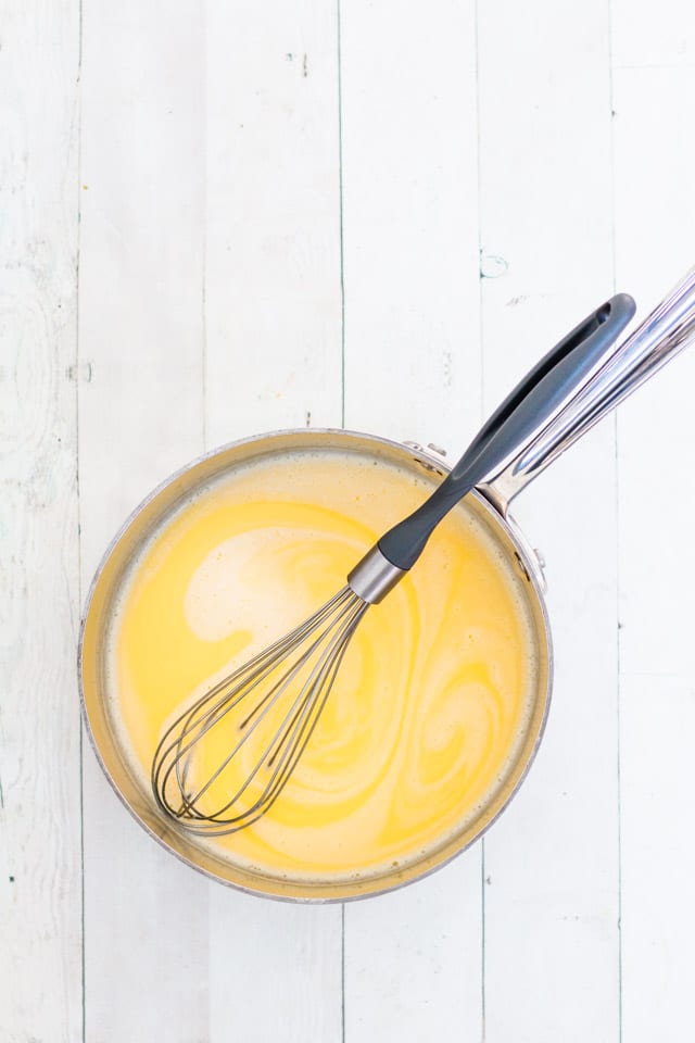 A small saucepan with steamed cream: step one in making homemade chocolate sauce