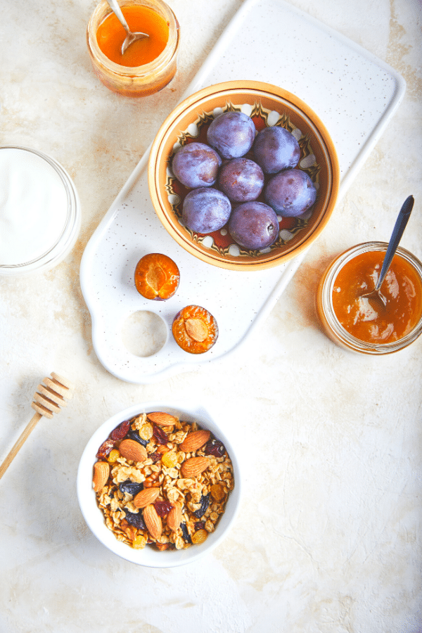 Overhead flat lay shot of ingredients required for a fruit and yogurt parfait cup