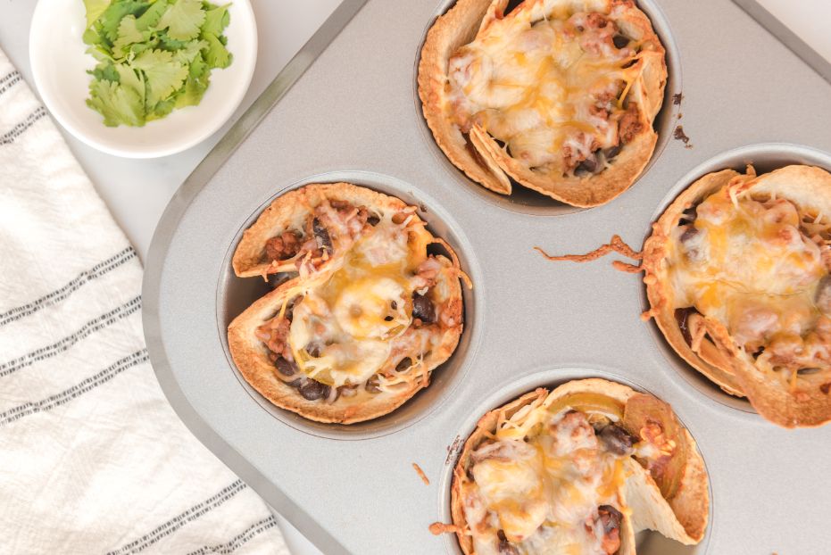 Enchilada beef cups served in a muffin pan