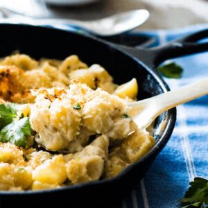 Gruyere and cauliflower mac and cheese served in a cast iron skillet