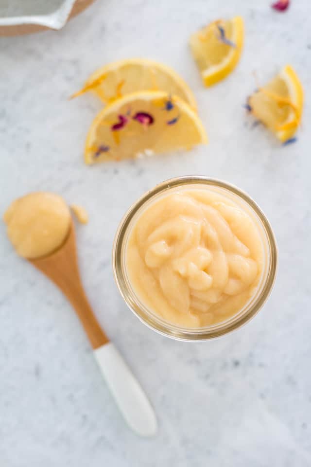 Thickened curd served on a wooden spoon with a white handle