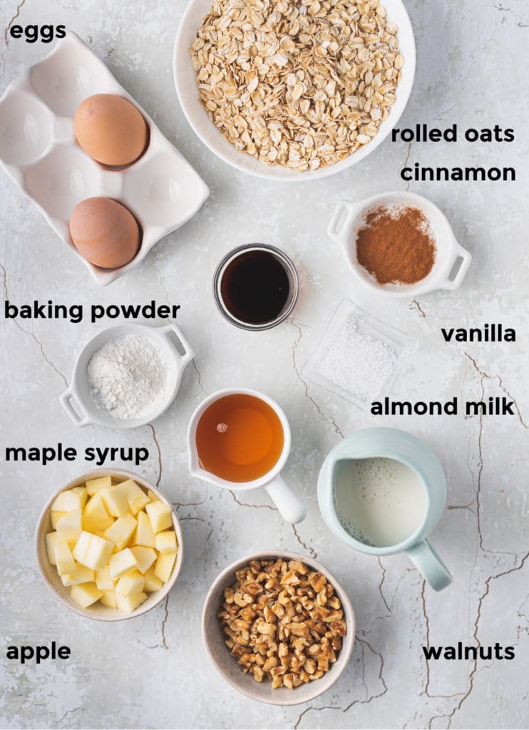 Overhead labelled shot of ingredients needed for apple cinnamon oatmeal cups