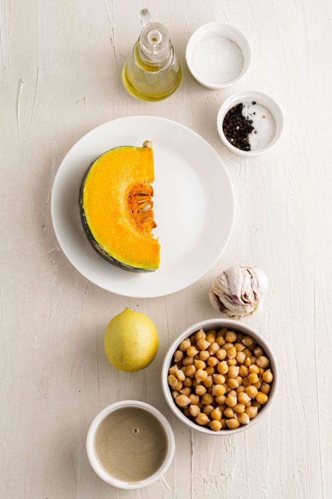 Ingredients for homemade pumpkin hummus in a food processor