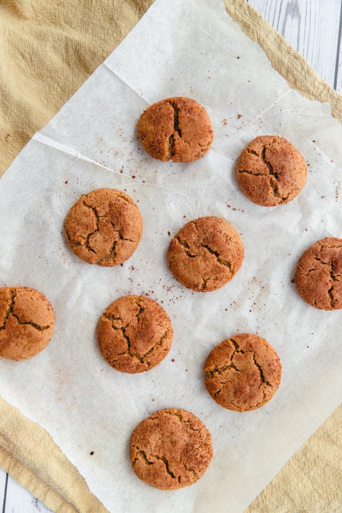 Baked ginger cookies on a piece of parchment paper