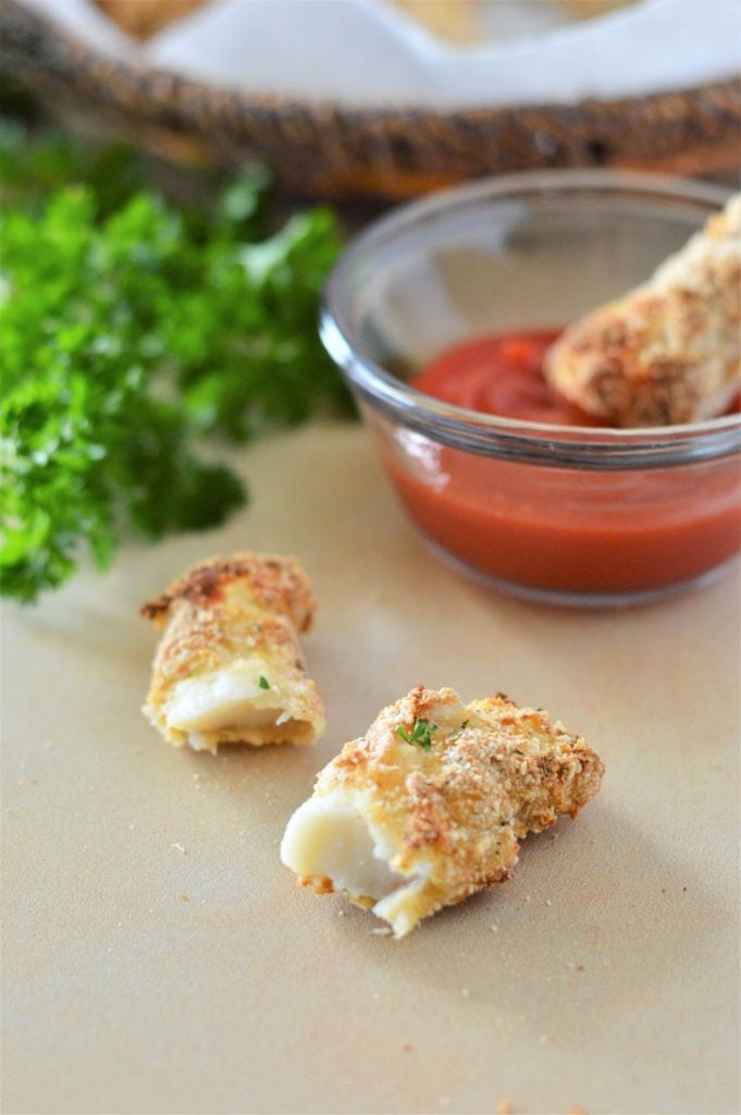 Serving fish fingers up for dinner with a side of tomato sauce