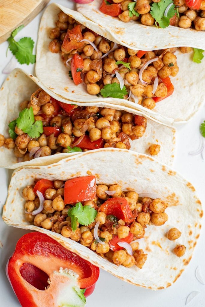 Vegan Chickpea tacos fill with a chickpea and bell pepper mixture and topped with fresh cilantro