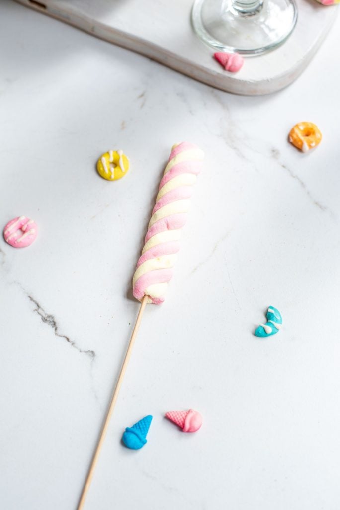 A marshmallow on a wooden skewer for decorating a milkshake