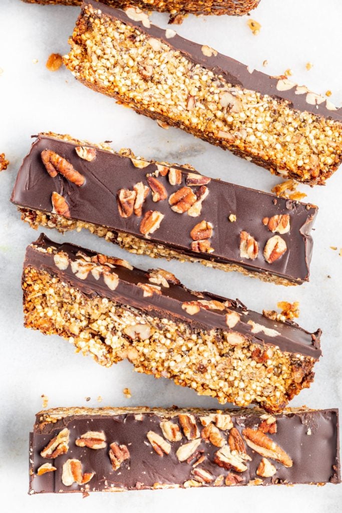 Overhead shot of chopped superfood bar lined up on parchment paper