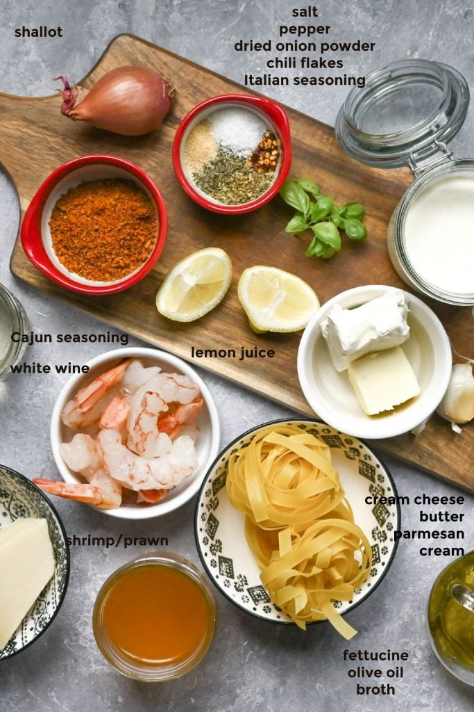 Overhead image of all of the ingredients required for making a creamy shrimp pasta