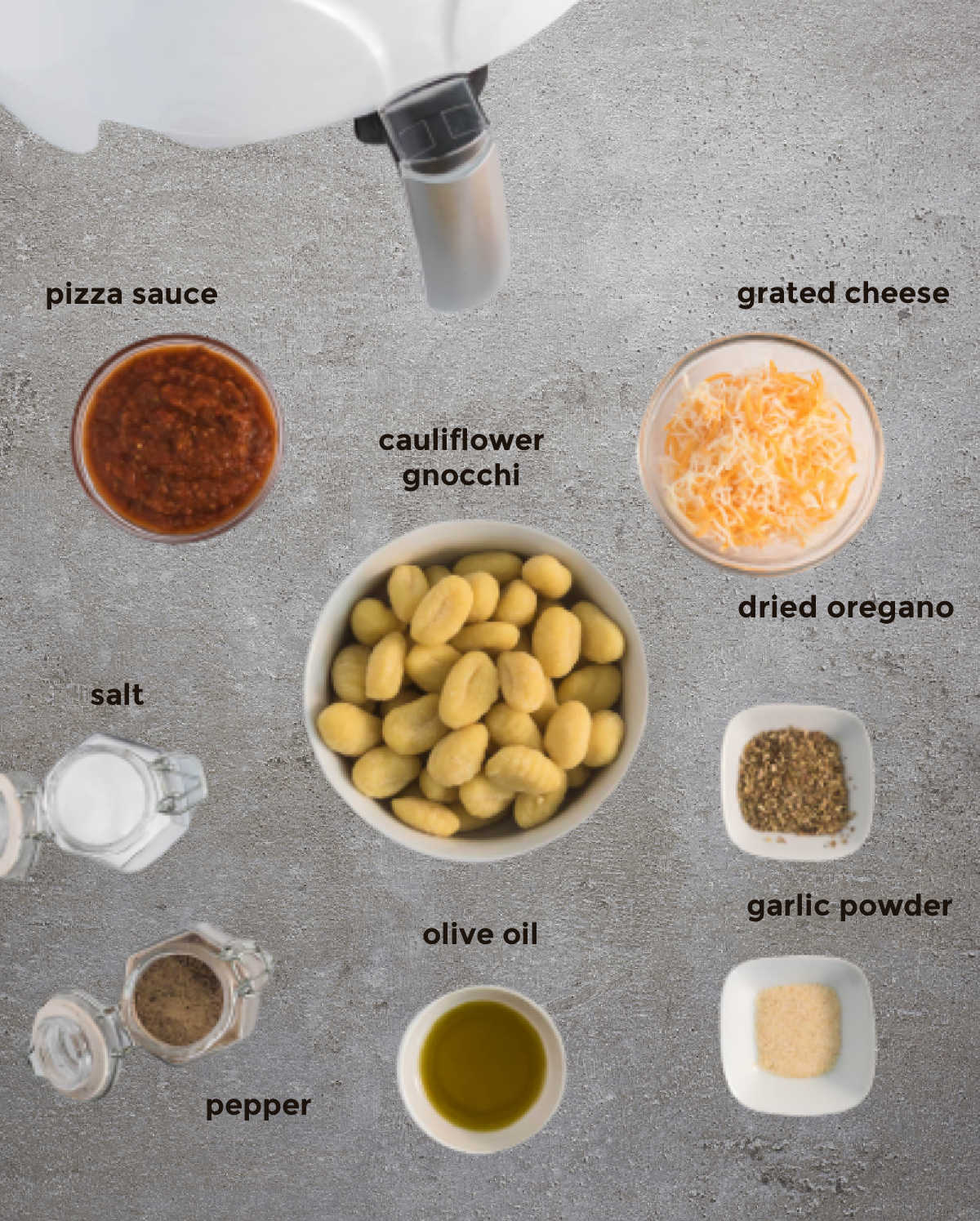 an overhead ingredient shot of ingredients needed for pizza gnocchi