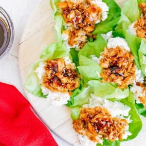 Overhead shot of teriyaki salmon lettuce cups served on a platter