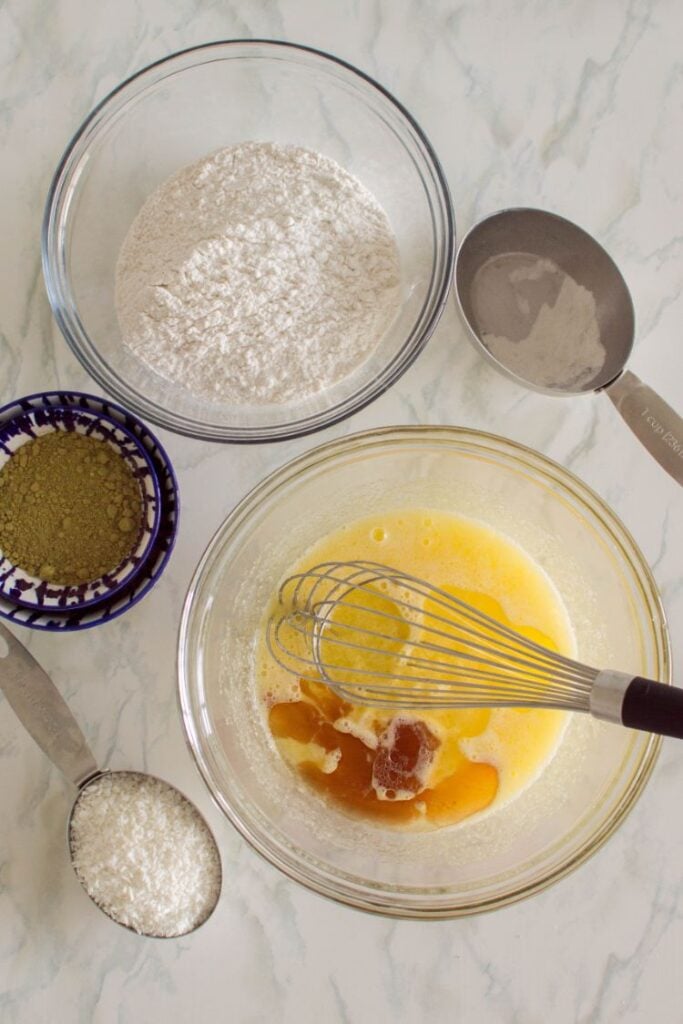 overhead shot of ingredients for cookies all displayed in small mixing bowls