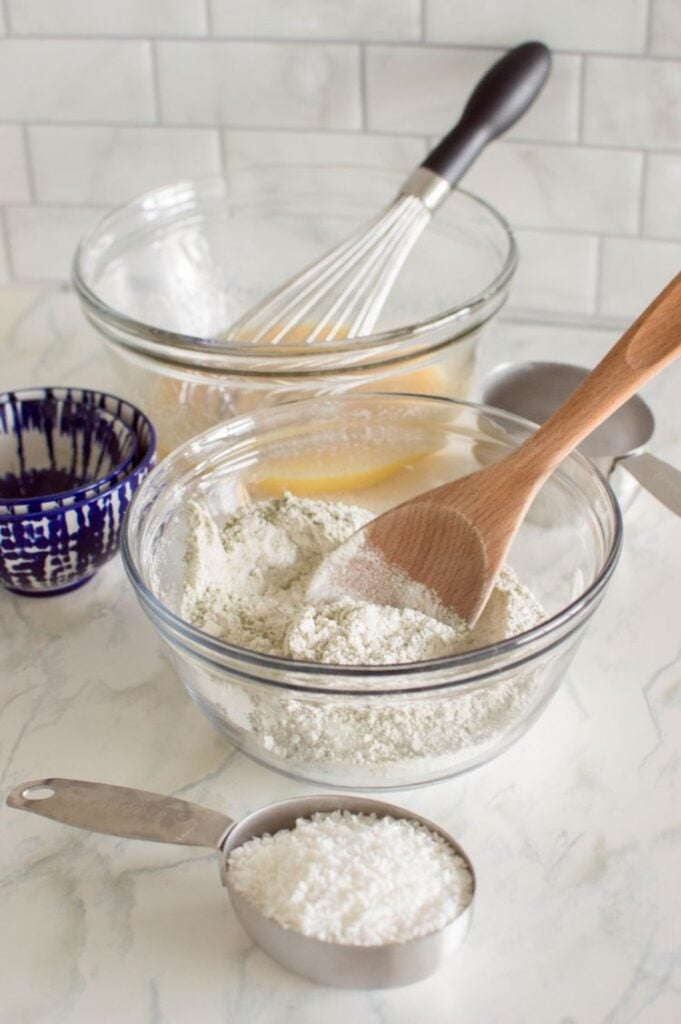 overhead shot of ingredients for cookies all displayed in small mixing bowls