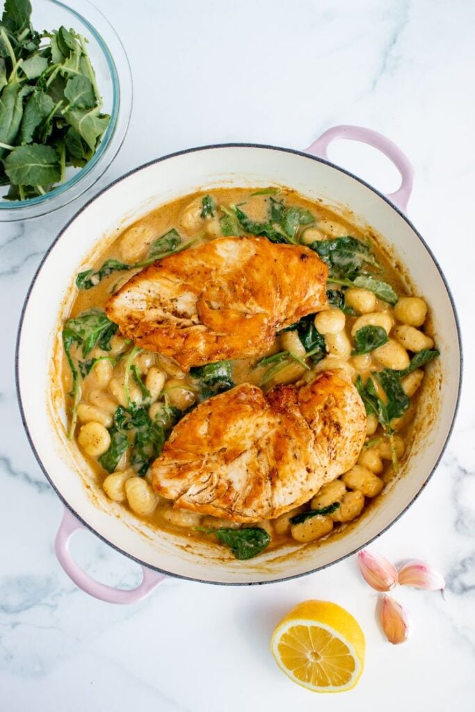 Whole chicken breasts with gnocchi in a creamy sauce with lemon all in one pot.