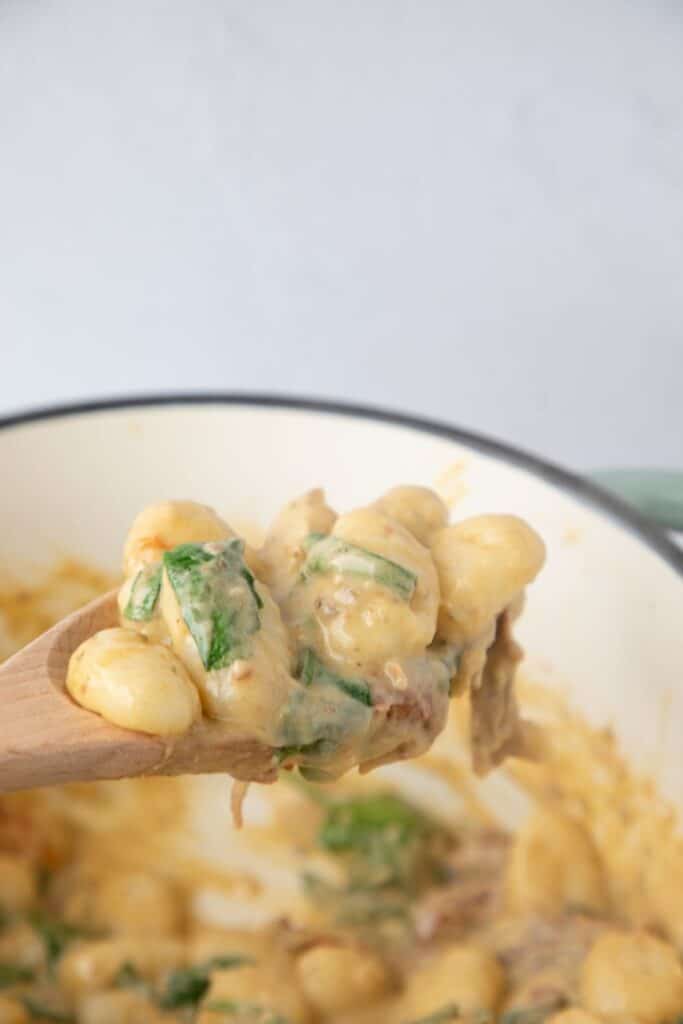 Stir everything with a wooden spoon until well combined and the gnocchi is coated in the creamy sauce