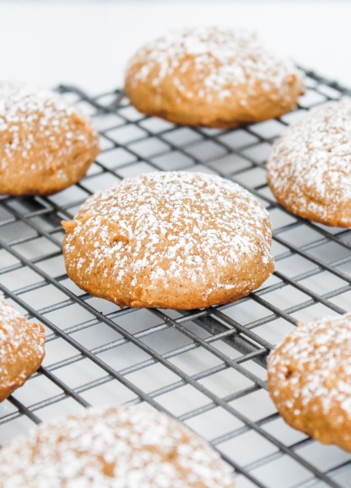 Up close shot of pumpkin cookies cooling on a wire rack