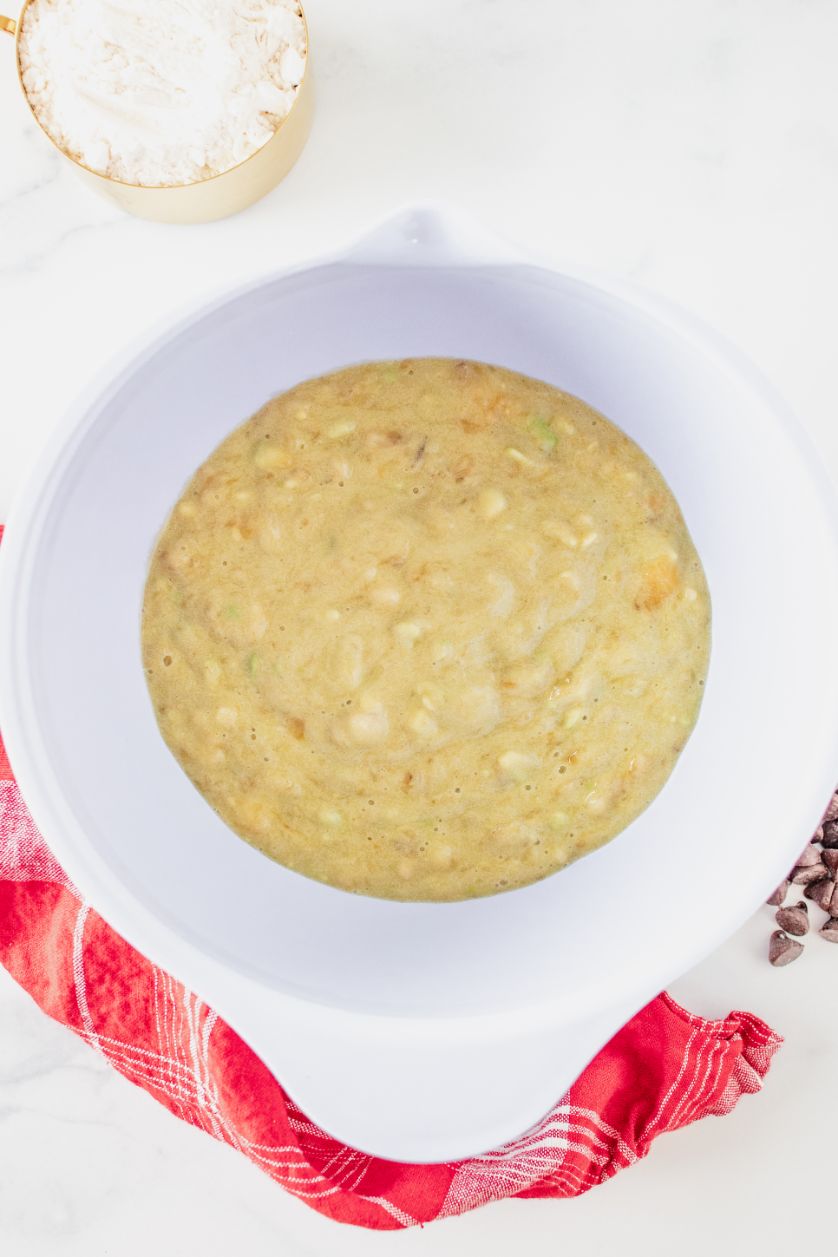 Overhead shot of mashed bananas in a white bowl