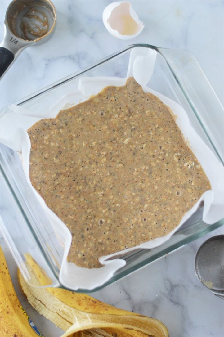 Banana bread bars mixture pressed into a prepared baking dish