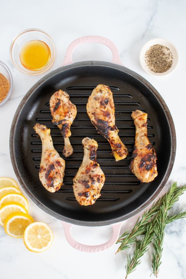 5 chicken drumsticks that have been grilled until cooked through and then basted with honey mustard marinade