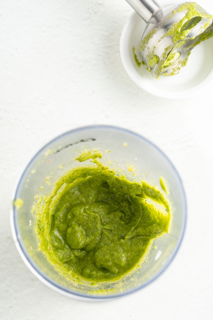 Basil pesto in the bowl of a food processor