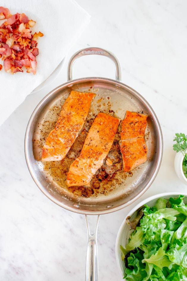 3 salmon fillets in a large saucepan