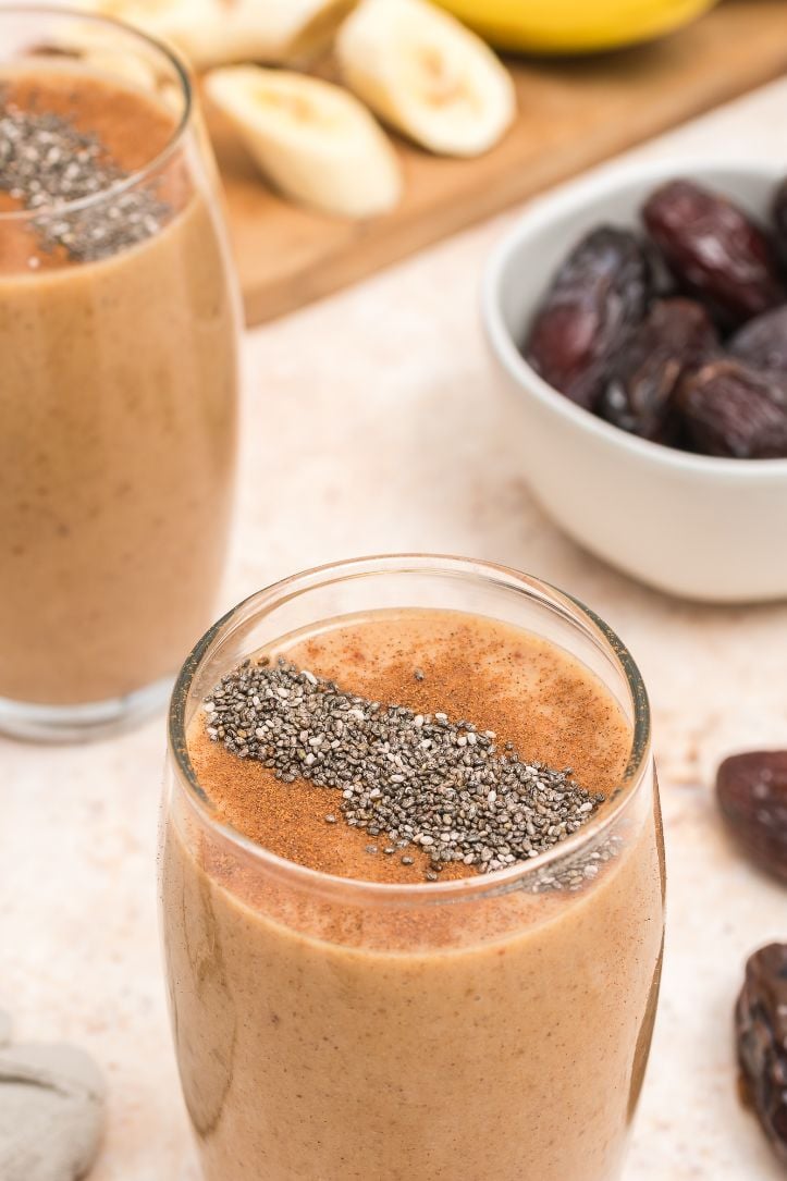chia seeds sprinkled on top of the date smoothie