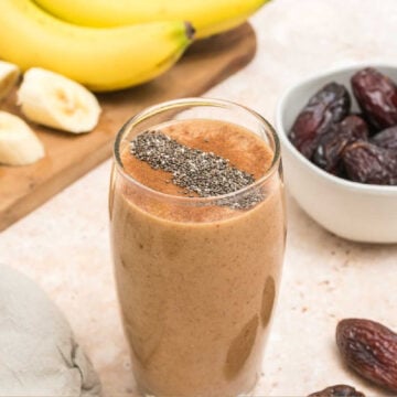 chia seeds sprinkled on top of the date smoothie