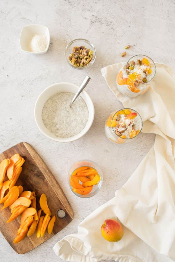 An overhead shot of the process of preparing a chia parfait breakfast