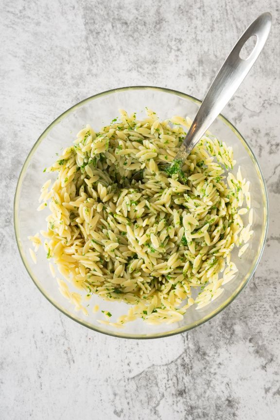 Add the pesto dressing to the cooked risoni and stir well to combine