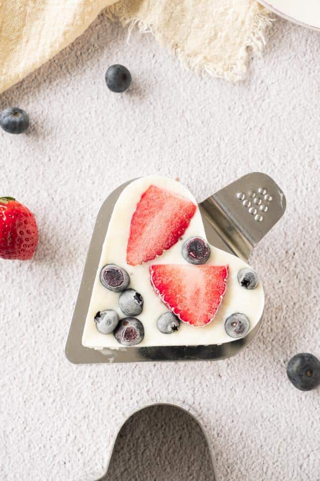 Frozen berry bark removed from the freezer and served on a heart shaped server