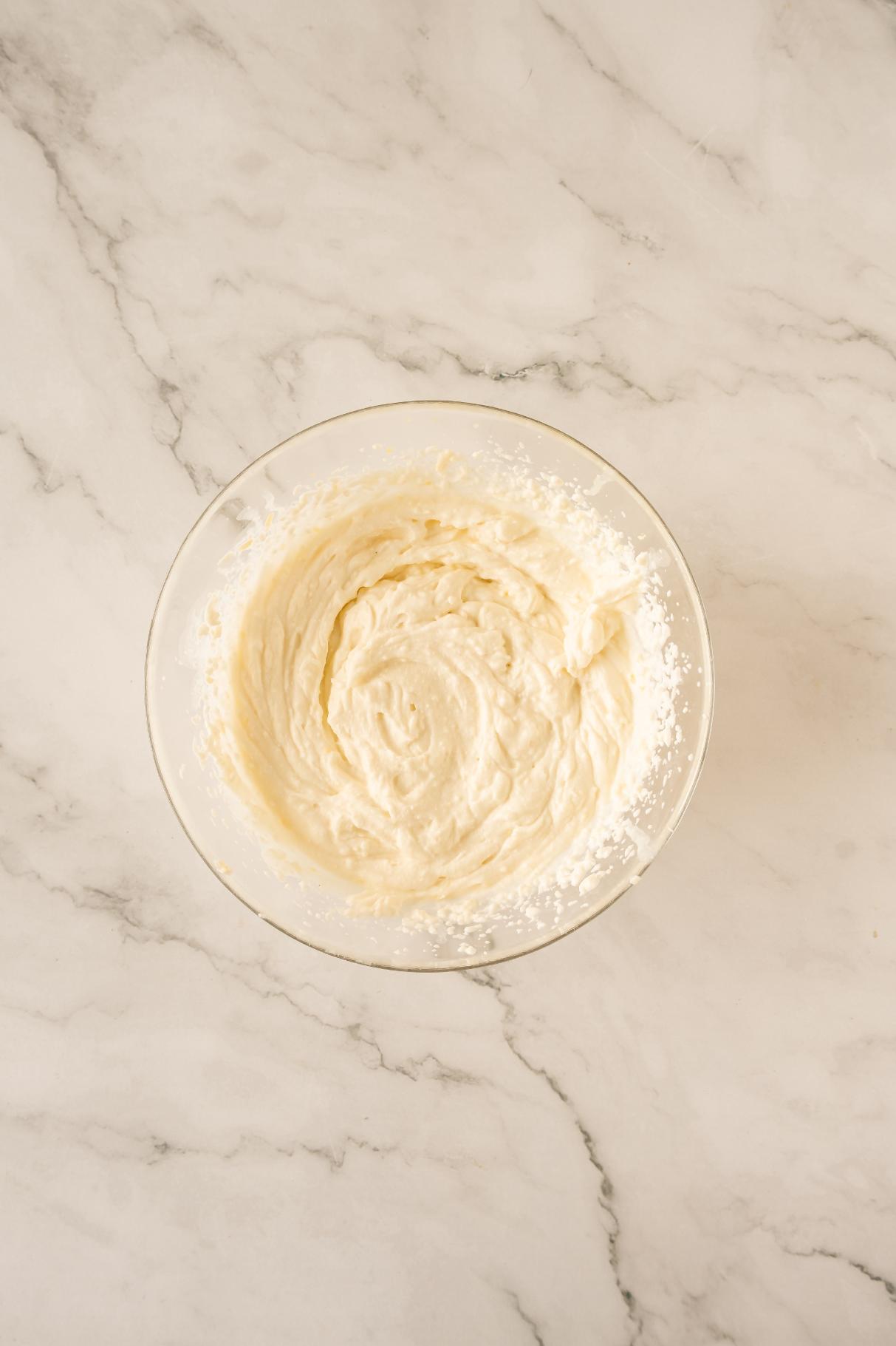 Cream cheese and powdered sugar between together until peaks form