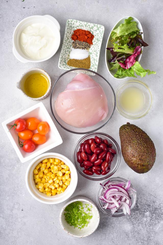 An overhead shot of ingredients required to make a chicken and bean salad