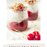 Hearty and healthy cherry chia pudding in glass jars, topped with nuts and grains for a nutritious snack or dessert.
