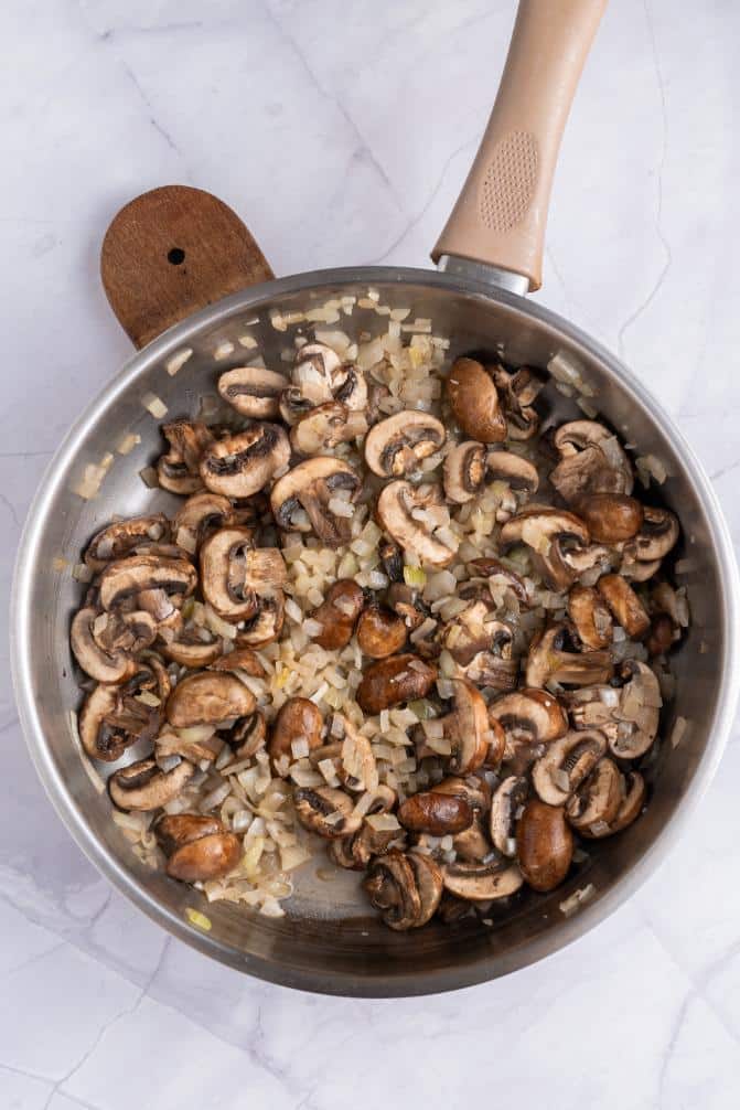 Mushrooms cooking in a saucepan