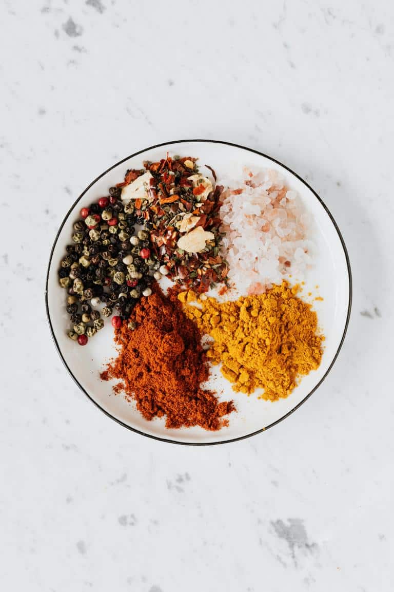 Overhead shot of spices on a white plate